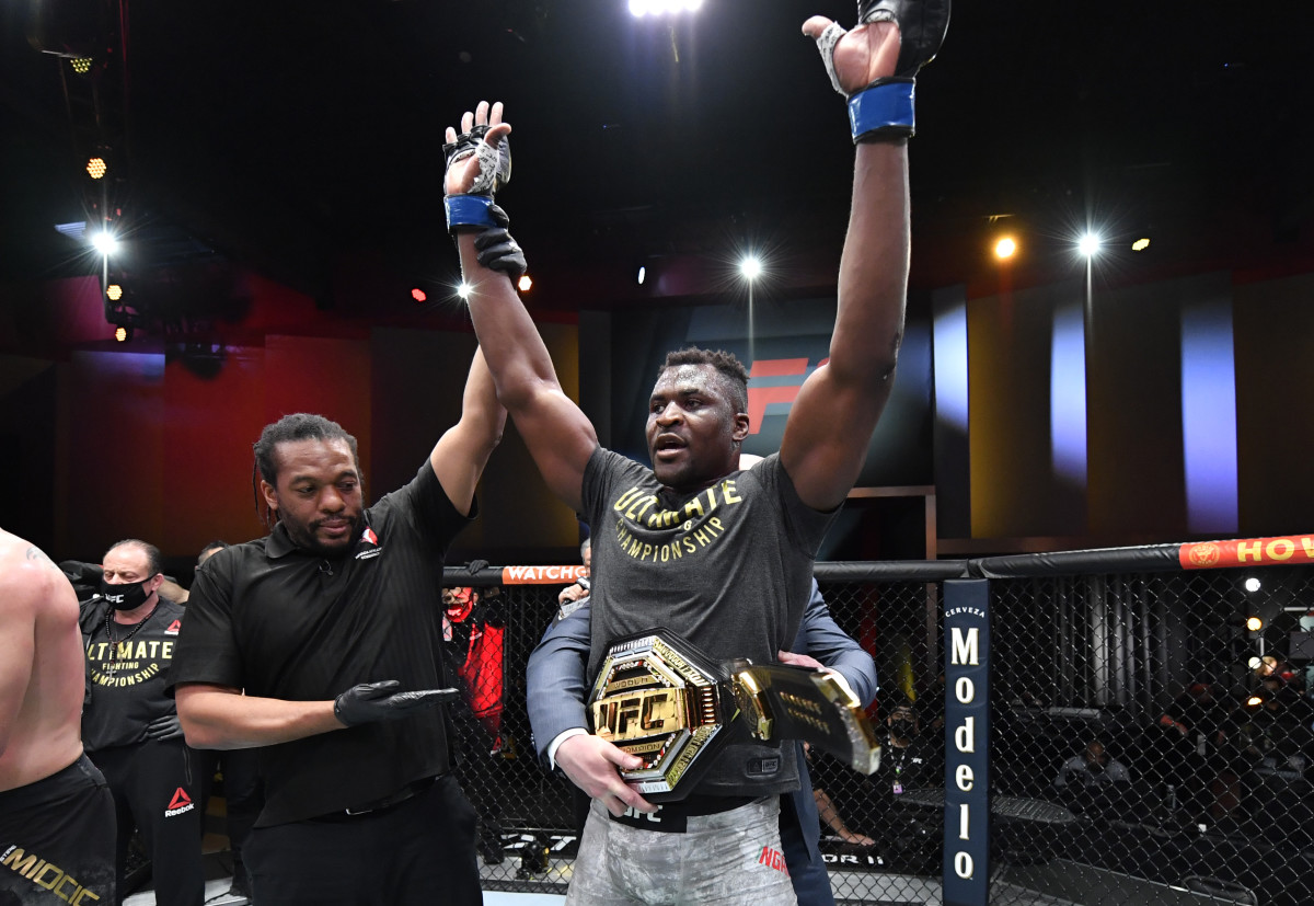 Francis Ngannou celebrates his victory over Stipe Miocic in UFC's heavyweight championship fight at  UFC 260 on March 27, 2021.