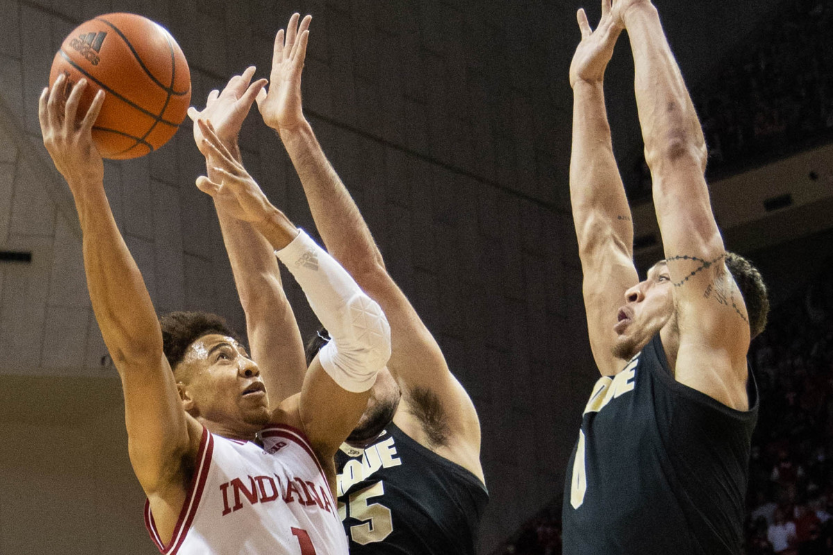 Rob Phinisee tries to shoot over Purdue defenders.
