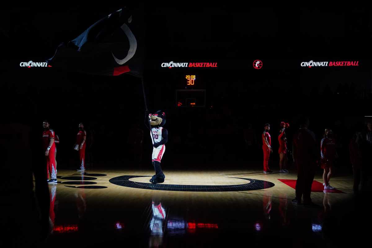 The Cincinnati Bearcats mascot waves the University of Cincinnati flag as the team is introduced before the first half of an NCAA men's college basketball game against the Tulsa Golden Hurricane, Thursday, Jan. 20, 2022, at Fifth Third Arena in Cincinnati. Tulsa Golden Hurricane At Cincinnati Bearcats Basketball Jan 20
