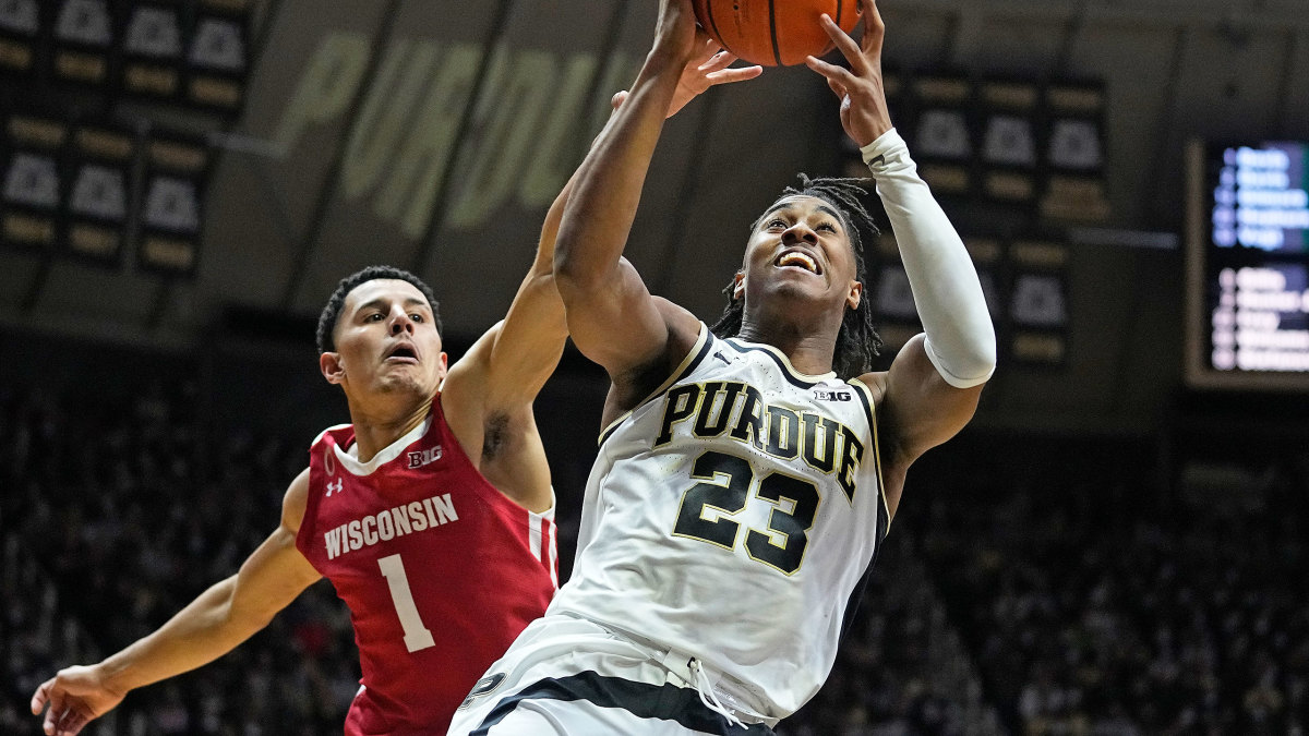 Purdue's Jaden Ivey shoots past Wisconsin's Johnny Davis