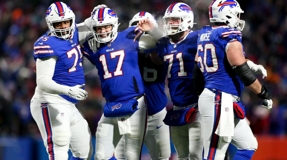 Buffalo Bills quarterback Josh Allen (17) celebrates after wide receiver Gabriel Davis (13) scores a touchdown during the second half of an NFL wild-card playoff football game against the New England Patriots, Saturday, Jan. 15, 2022, in Orchard Park, N.Y.