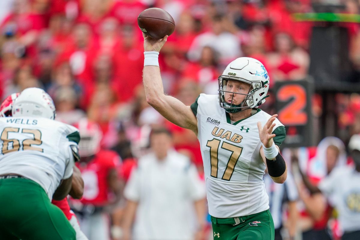 UAB Blazers quarterback Tyler Johnston III (17) passes against the Georgia Bulldogs during the first quarter at Sanford Stadium.