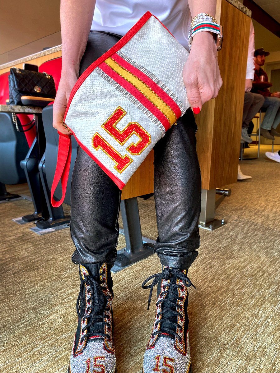 Randi Mahomes, mother of Patrick Mahomes, wears a bedazzled purse and shoes adorned with her son's jersey number.