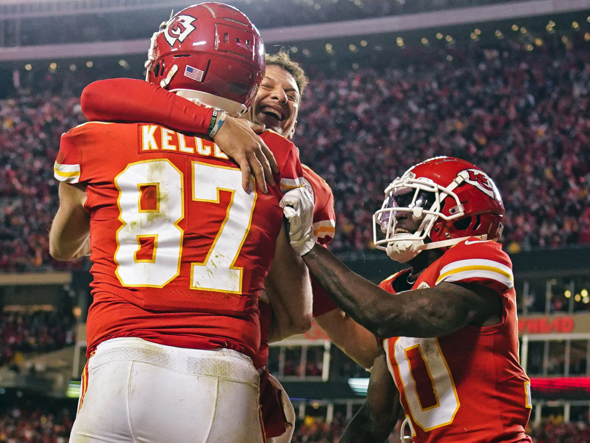 Travis Kelce, Patrick Mahomes and Tyreek Hill celebrate the game-winning touchdown.
