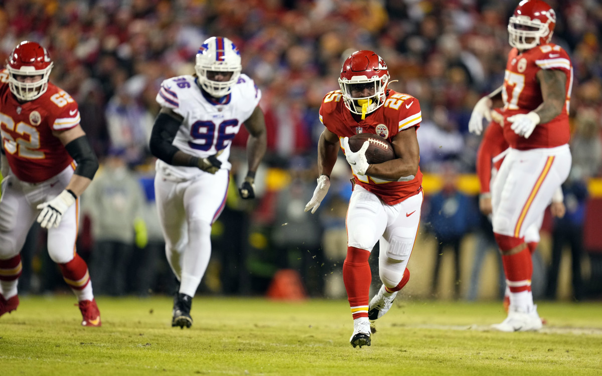 Jan 23, 2022; Kansas City, Missouri, USA; Kansas City Chiefs running back Clyde Edwards-Helaire (25) carries the ball against the Buffalo Bills during the first half in the AFC Divisional playoff football game at GEHA Field at Arrowhead Stadium. Mandatory Credit: Jay Biggerstaff-USA TODAY Sports