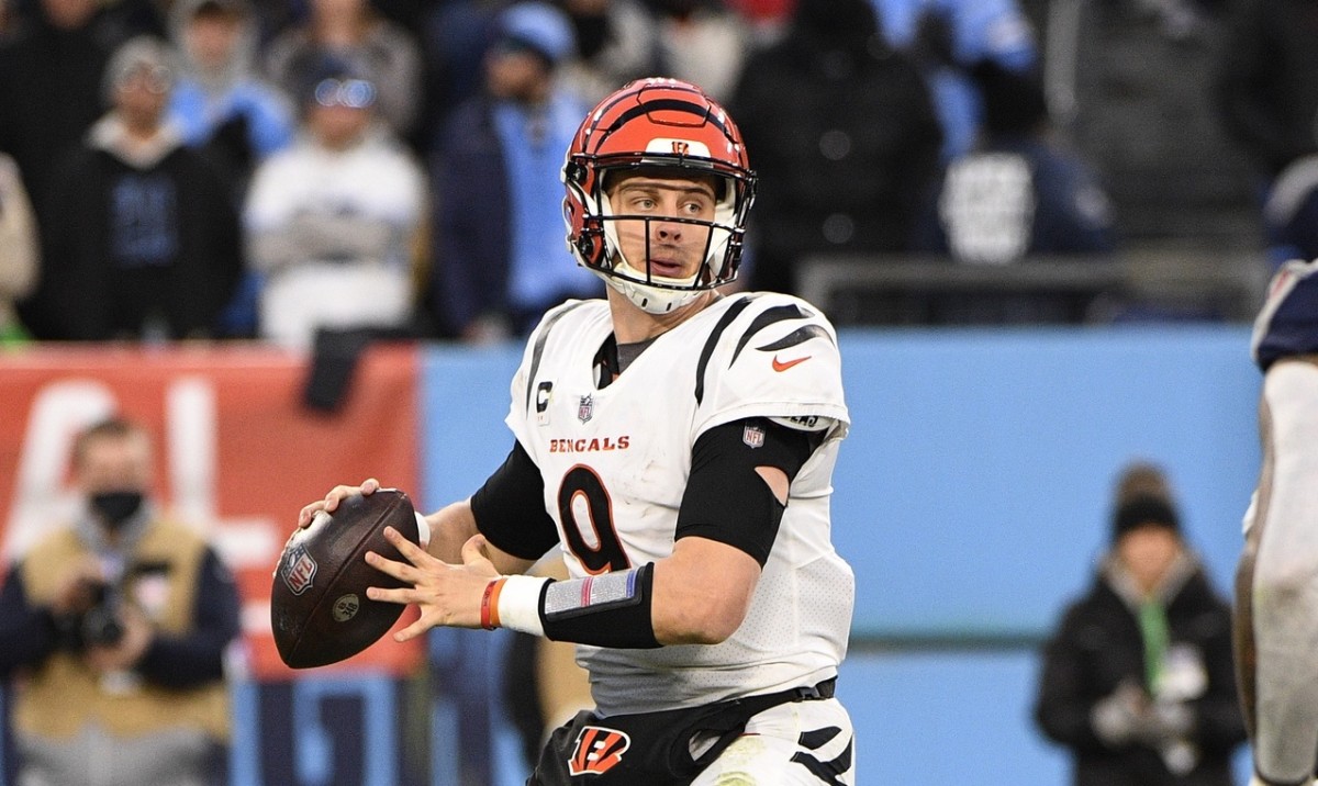 Jan 22, 2022; Nashville, Tennessee, USA; Cincinnati Bengals quarterback Joe Burrow (9) drops to throw during the second half of an AFC Divisional playoff football game against the Tennessee Titans at Nissan Stadium. Mandatory Credit: Steve Roberts-USA TODAY Sports