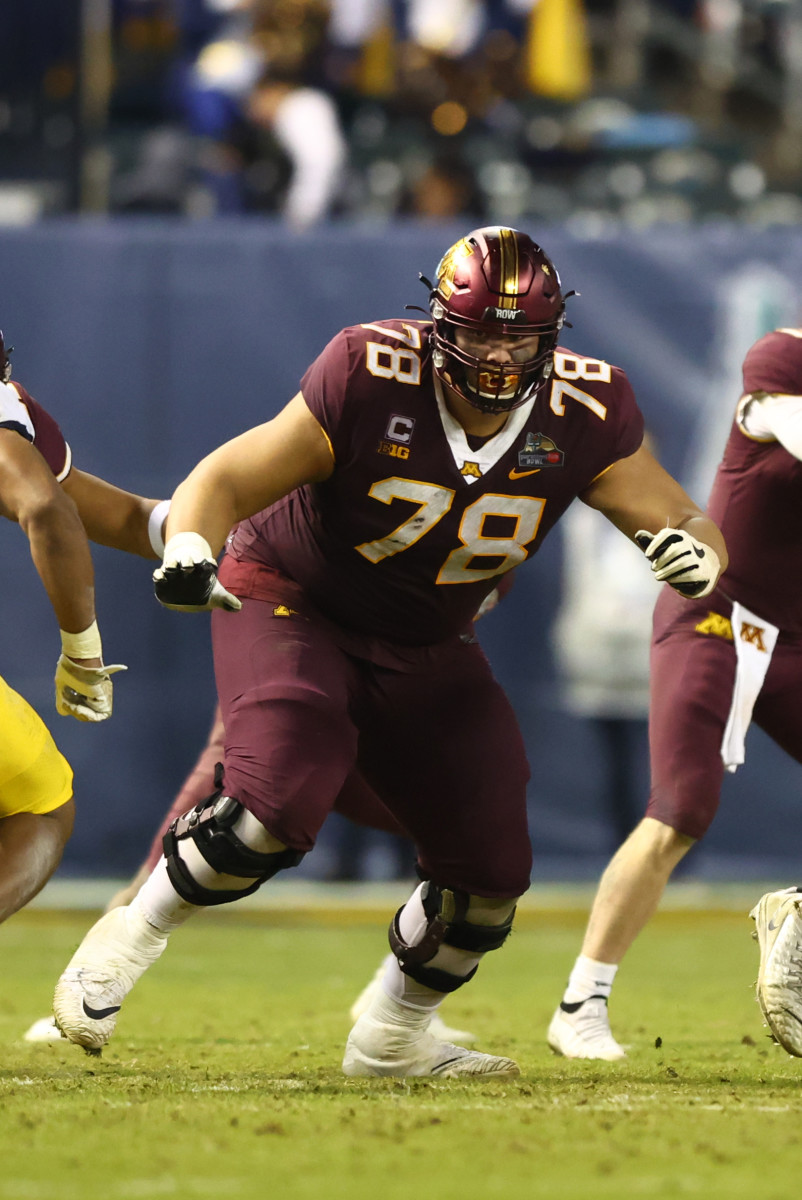 Dec 28, 2021; Phoenix, AZ, USA; Minnesota Golden Gophers offensive lineman Daniel Faalele (78) against the West Virginia Mountaineers in the Guaranteed Rate Bowl at Chase Field. Mandatory Credit: Mark J. Rebilas-USA TODAY Sports