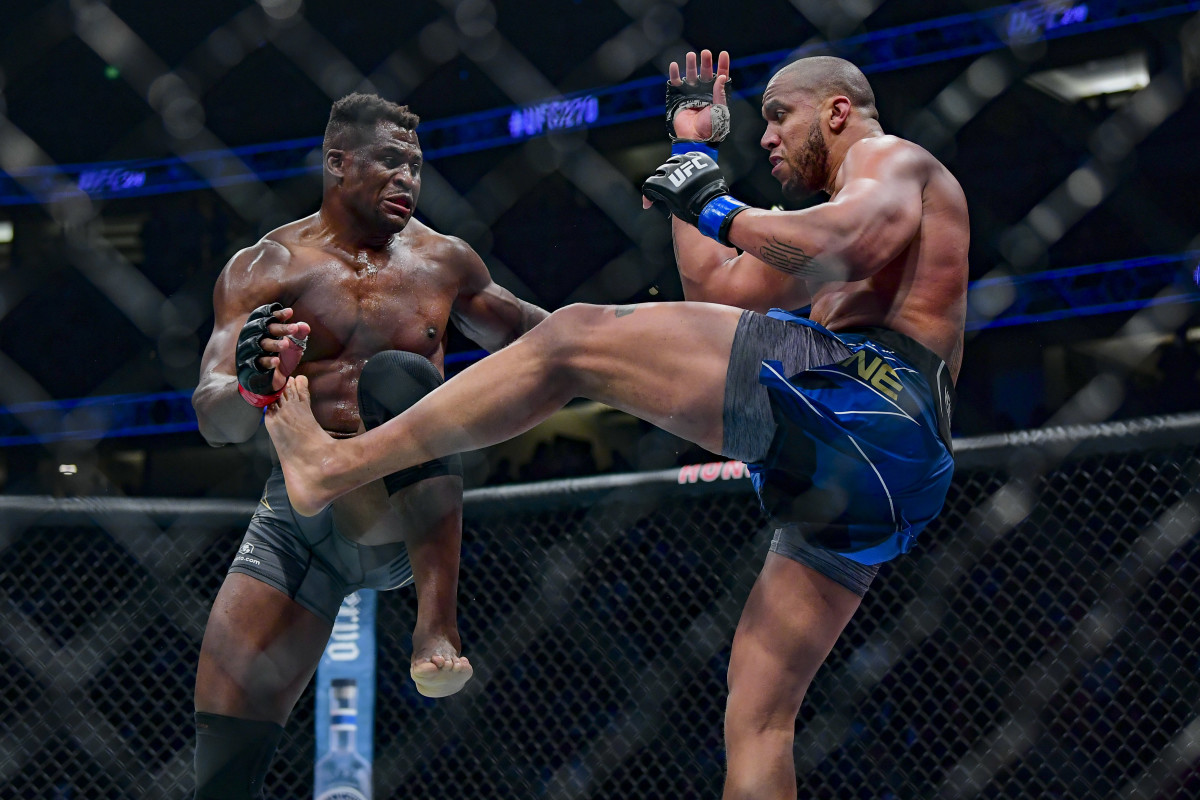 Ngannnou (l.) defeats Gane in the UFC heavyweight championship at UFC 270. 