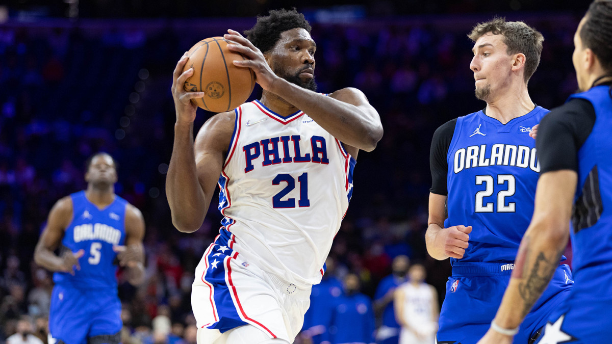 Philadelphia 76ers center Joel Embiid (21) drives against Orlando Magic forward Franz Wagner