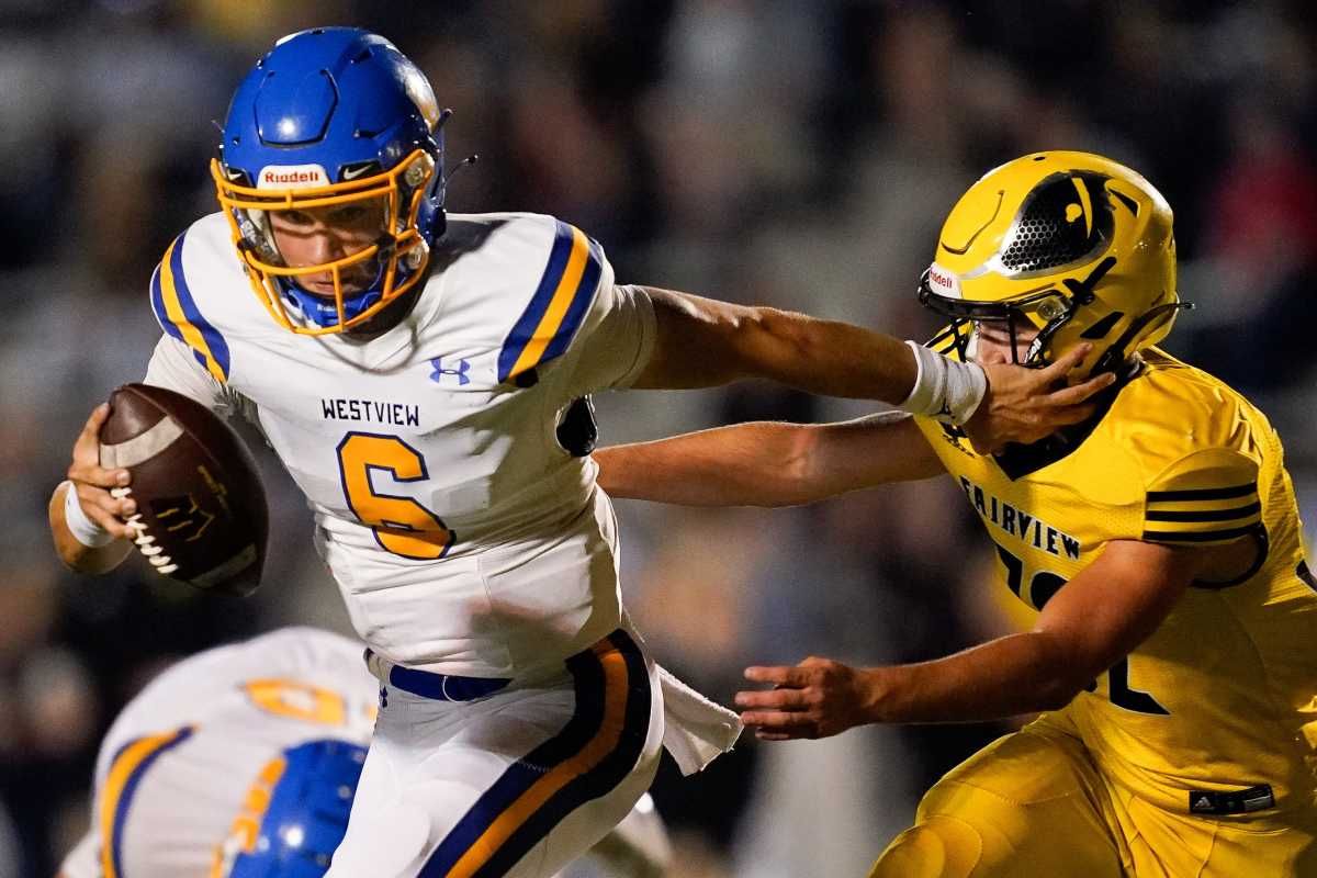 Westview's Ty Simpson (6) takes a hit from Fairview's Jonathan Perkerson (32) during the first half at Fairview High School in Fairview, Tenn., Friday, Sept. 10, 2021.