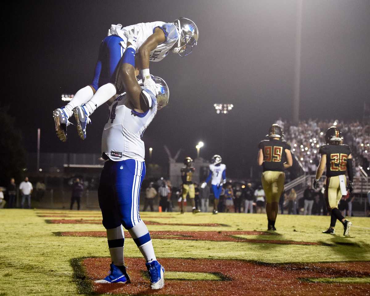 IMG Academy's Xavier Terrell (5) celebrates his touchdown against Ravenwood with Tyler Booker (54) during the second half at Ravenwood High School in Brentwood, Tenn., Friday, Sept. 25, 2020.