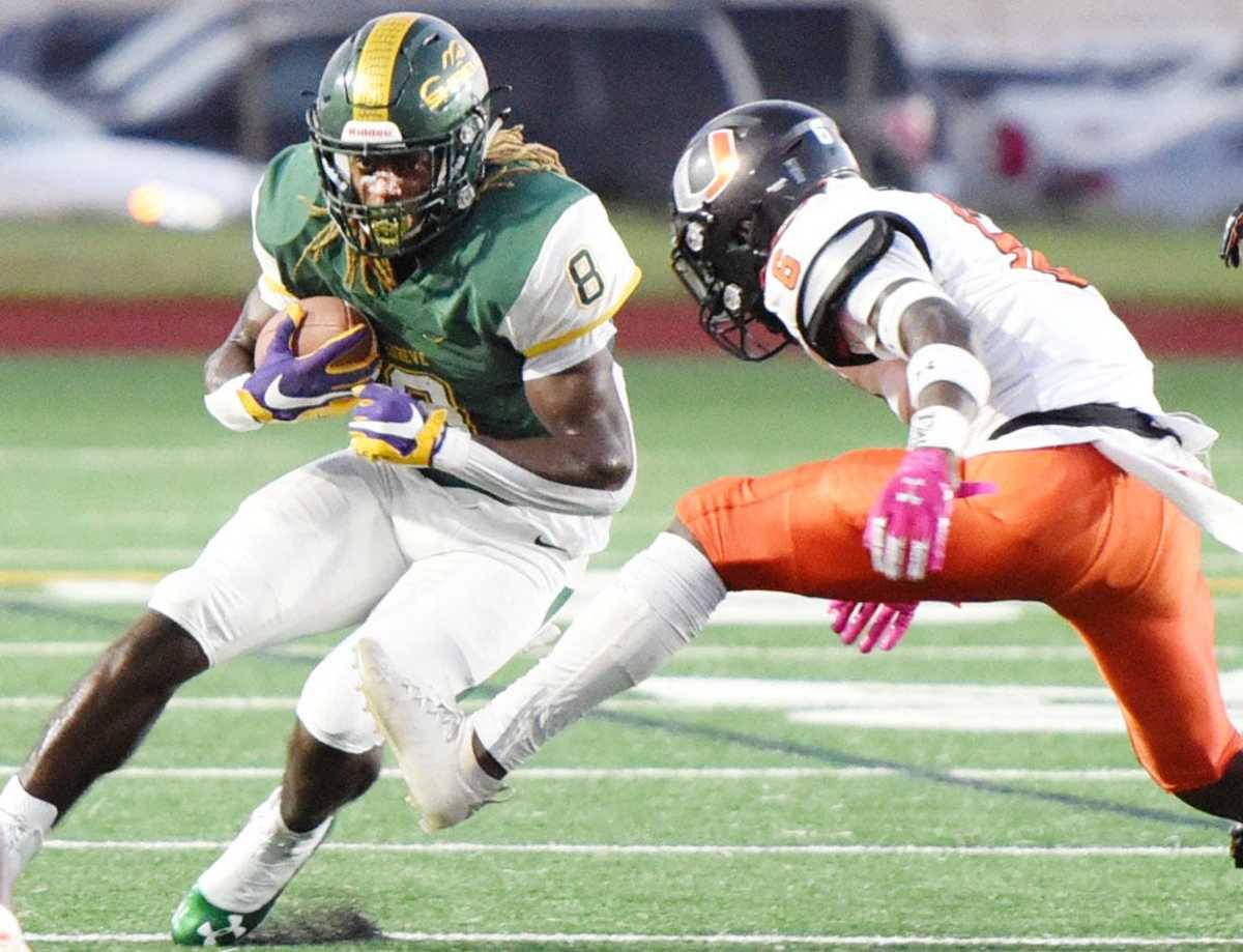 Captain Shreve's Kendrick Law Jr. makes a move on Union Parish's Dorien Henderson during Friday's game at Lee Hedges Stadium.