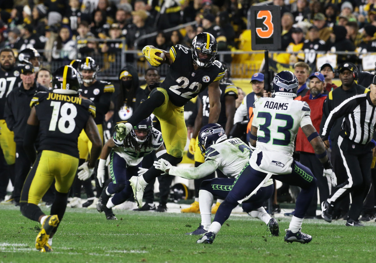 Pittsburgh Steelers running back Najee Harris (22) attempts to hurdle Seattle Seahawks cornerback D.J. Reed (2) during the fourth quarter at Heinz Field. Pittsburgh won 23-20 in overtime.