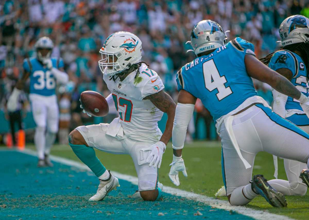 Miami Dolphins wide receiver Jaylen Waddle (17) celebrates after scoring a rushing touchdown agains the Carolina Panthers during NFL game at Hard Rock Stadium Sunday in Miami Gardens.