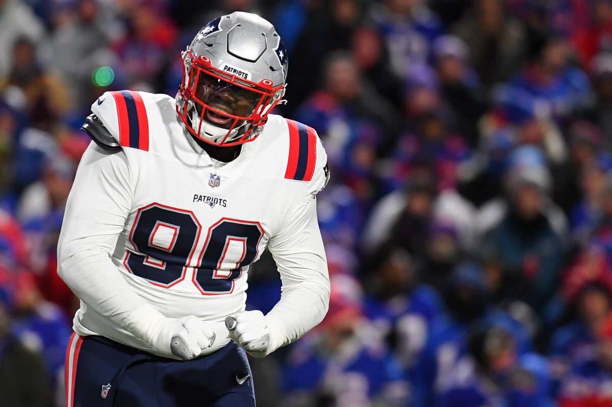 New England Patriots defensive end Christian Barmore (90) reacts to a defensive play against the Buffalo Bills during the first half at Highmark Stadium.