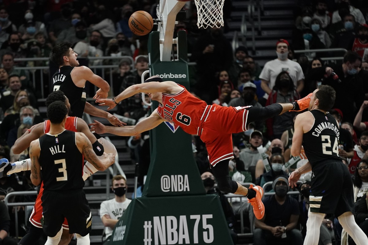 Chicago guard Alex Caruso will miss four-to-six weeks with a fractured wrist after taking this hard foul from Grayson Allen (far left).