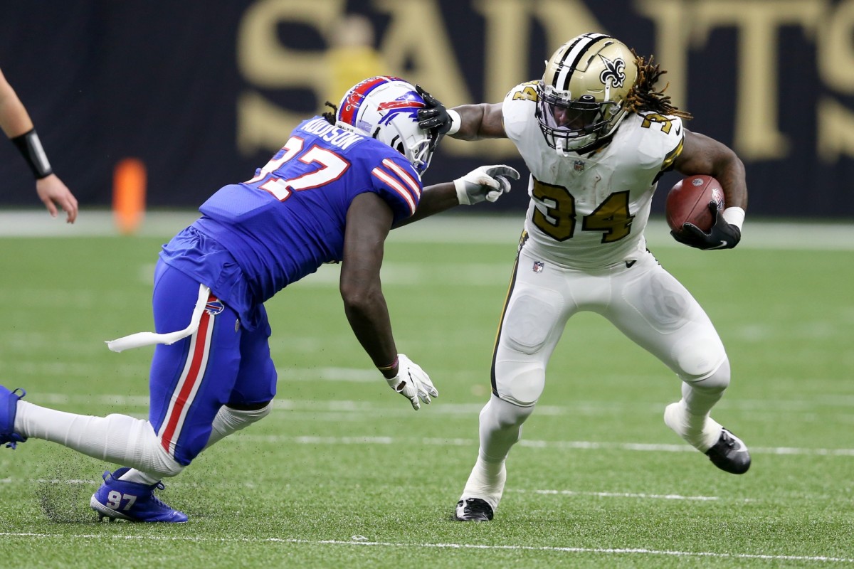 New Orleans Saints running back Tony Jones Jr. (34) is tackled by Buffalo Bills defensive end Mario Addison (97). Mandatory Credit: Chuck Cook-USA TODAY 