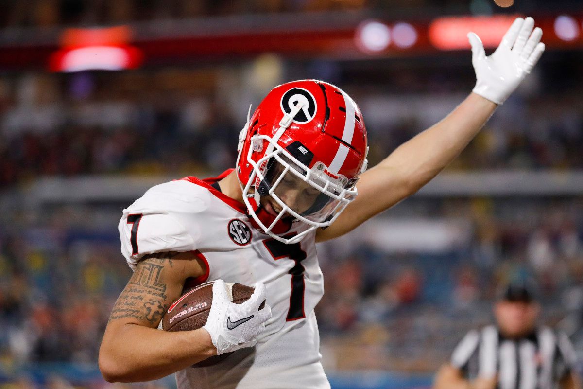 Georgia Bulldogs wide receiver Jermaine Burton (7) celebrates in the end zone after scoring a touchdown against the Michigan Wolverines in the second quarter during the Orange Bowl college football CFP national semifinal game at Hard Rock Stadium.