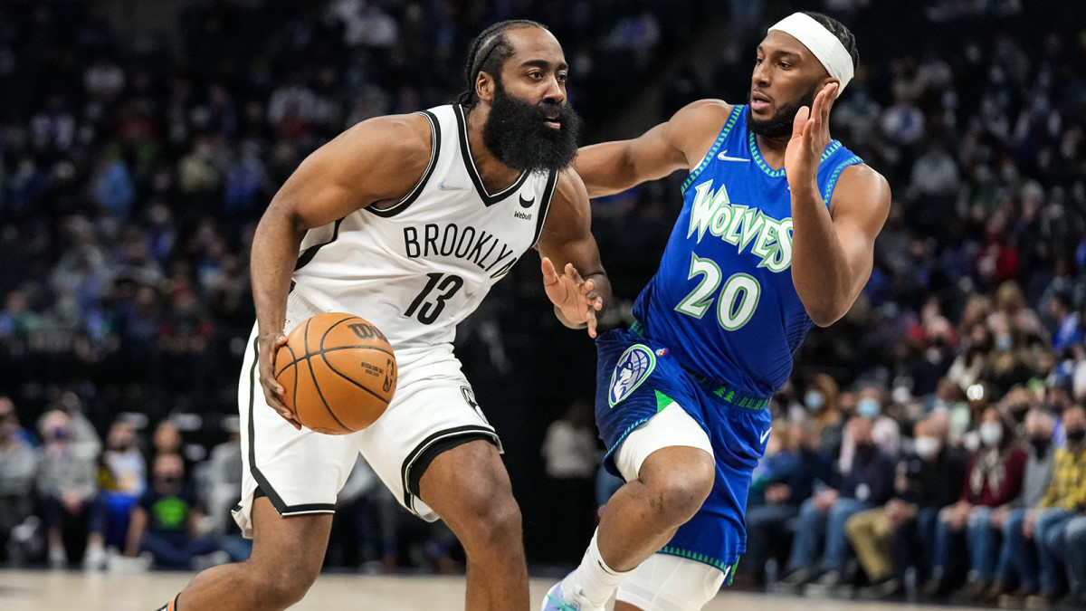 Brooklyn Nets guard James Harden (13) dribbles past Minnesota Timberwolves forward Josh Okogie (20) during the second quarter