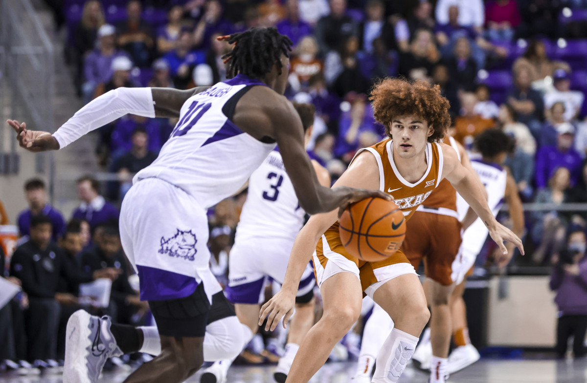 Jan 25, 2022; Fort Worth, Texas, USA; Texas Longhorns guard Devin Askew (5) guards TCU Horned Frogs guard Damion Baugh (10) during the second half at Ed and Rae Schollmaier Arena.