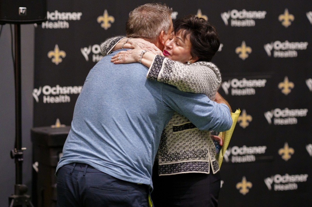 New Orleans Saints head coach Sean Payton hugs team owner Gayle Benson