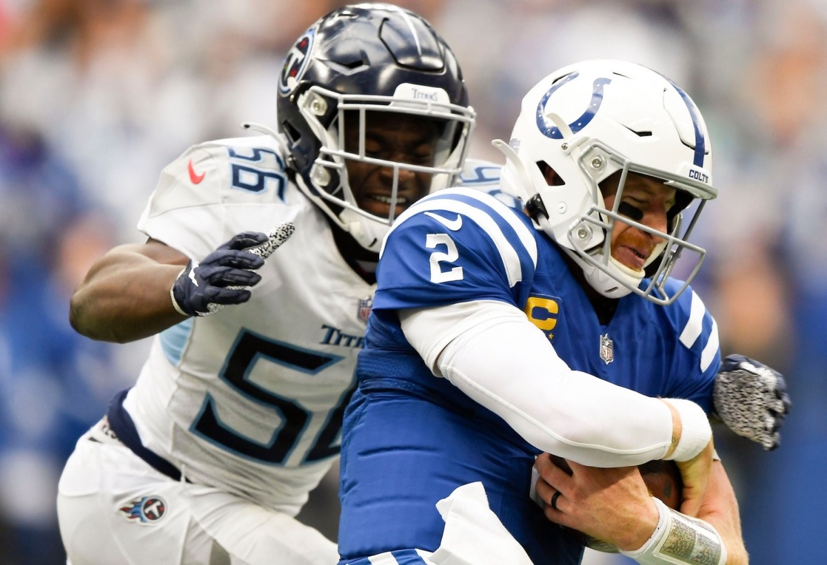 Tennessee Titans linebacker Monty Rice (56) stops Indianapolis Colts quarterback Carson Wentz (2) during overtime at Lucas Oil Stadium Sunday, Oct. 31, 2021 in Indianapolis, Ind.
