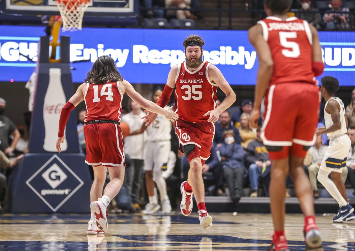 Jan 26, 2022; Morgantown, West Virginia, USA; Oklahoma Sooners forward Tanner Groves (35) celebrates with Oklahoma Sooners guard Bijan Cortes (14) during the second half at WVU Coliseum.