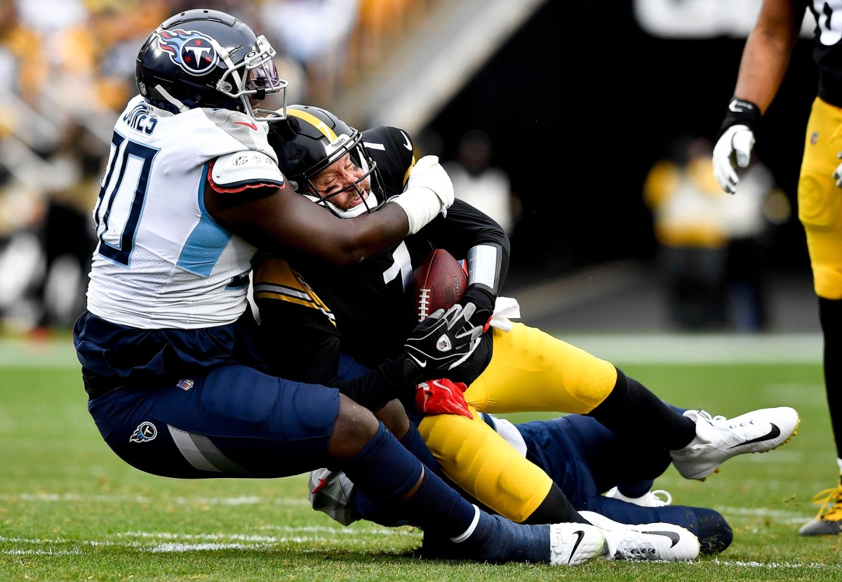Pittsburgh Steelers quarterback Ben Roethlisberger (7) is sacked by Tennessee Titans defensive tackle Naquan Jones (90) during the first quarter at Heinz Field.