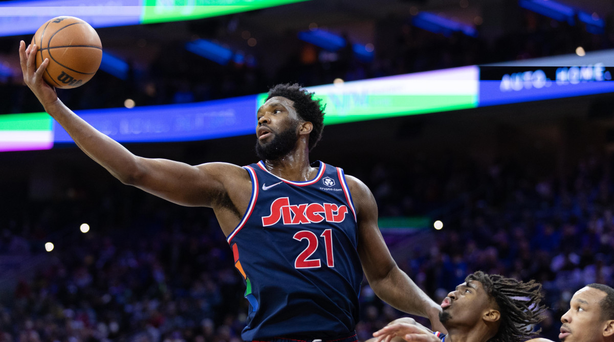 76ers center Joel Embiid (21) reaches for a rebound against the Los Angeles Lakers during the second quarter at Wells Fargo Center.