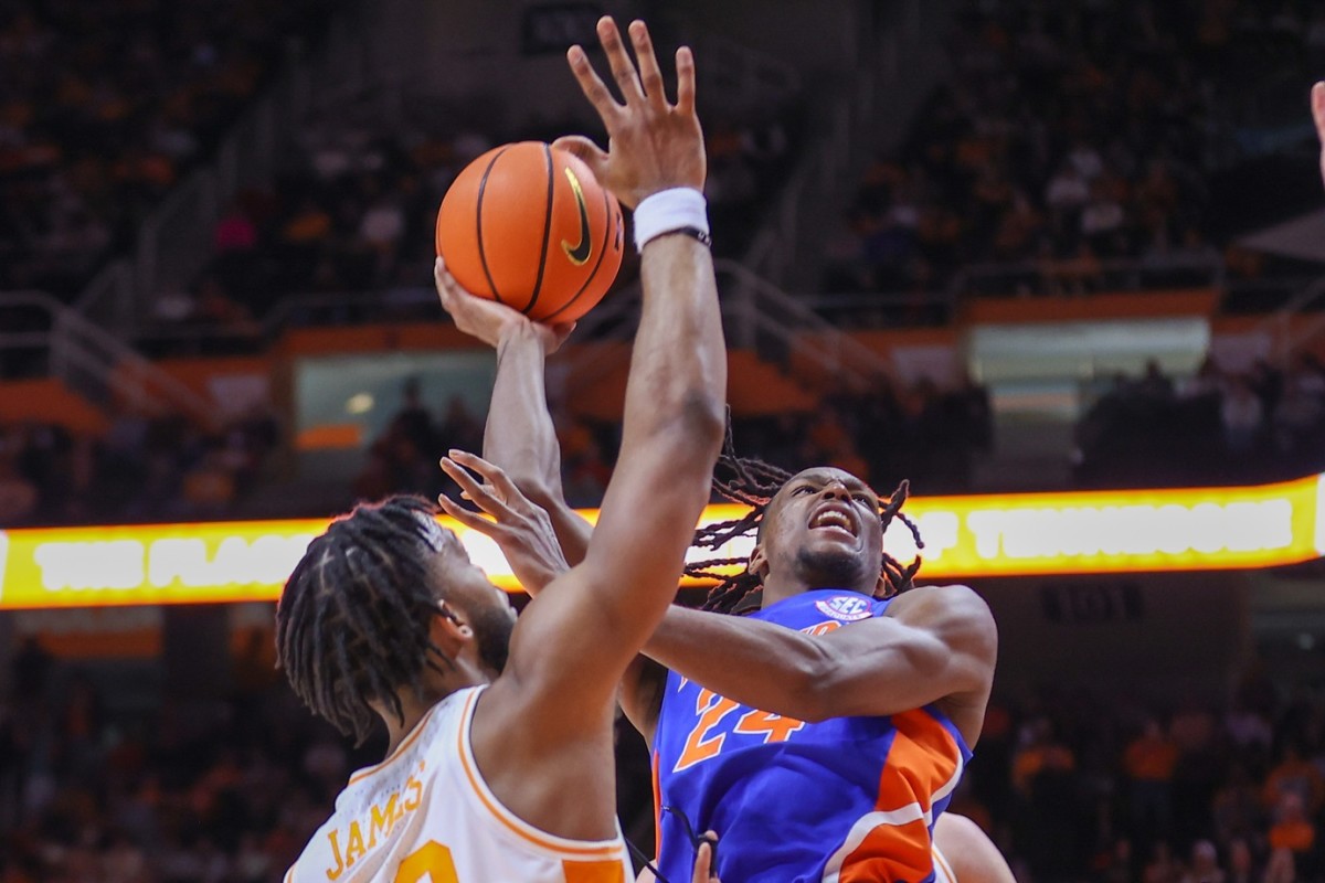 Florida Gators guard Phlandrous Fleming Jr. (24) goes to the basket against Tennessee Volunteers guard Josiah-Jordan James (30) during the second half at Thompson-Boling Arena.