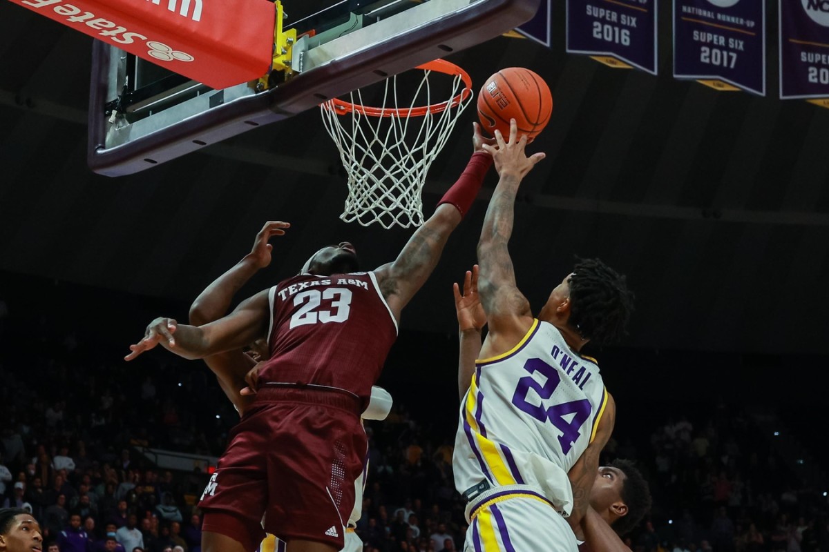Texas A&M Aggies guard Tyrece Radford (23) goes for a rebound against LSU Tigers forward Shareef O'Neal (24) during the second half at the Pete Maravich Assembly Center.