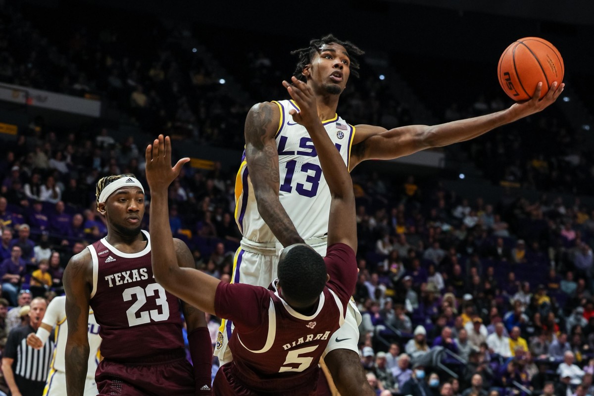 LSU Tigers forward Tari Eason (13) moves to the basket against Texas A&M Aggies guard Hassan Diarra (5) during the first half at the Pete Maravich Assembly Center.