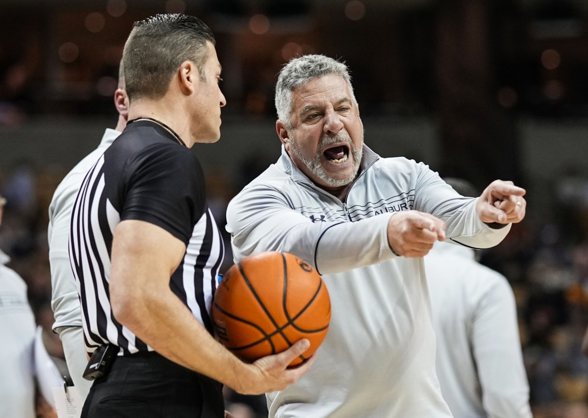 Auburn Tigers head coach Bruce Pearl talks with referee Lee Cassell during the second half against the Missouri Tigers at Mizzou Arena.