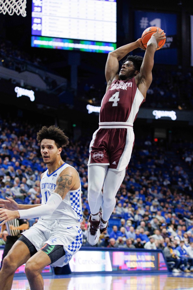 Mississippi State Bulldogs guard Cameron Matthews (4) dunks the ball during the first half against the Kentucky Wildcats at Rupp Arena at Central Bank Center.