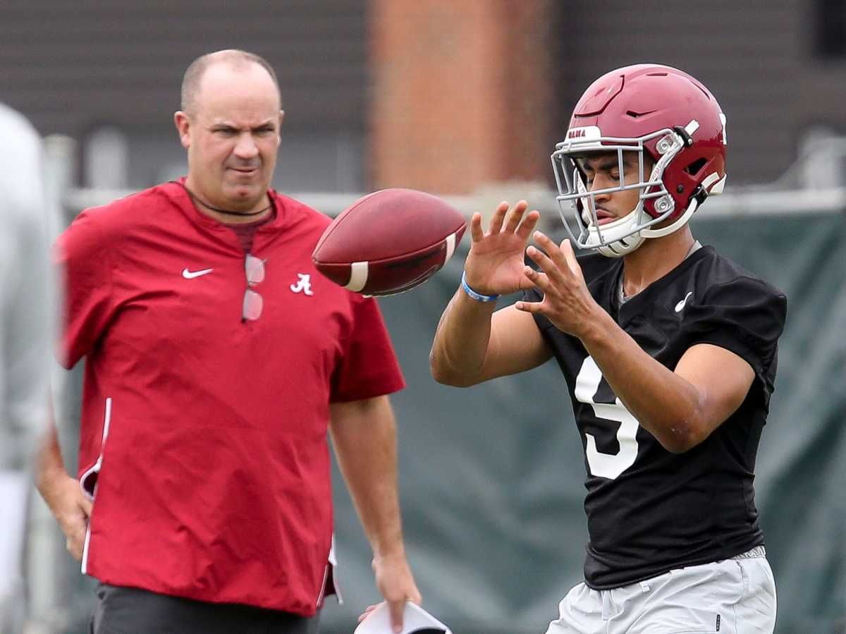Bill O'Brien watches quarterback Bryce Young take a snap during practice.
