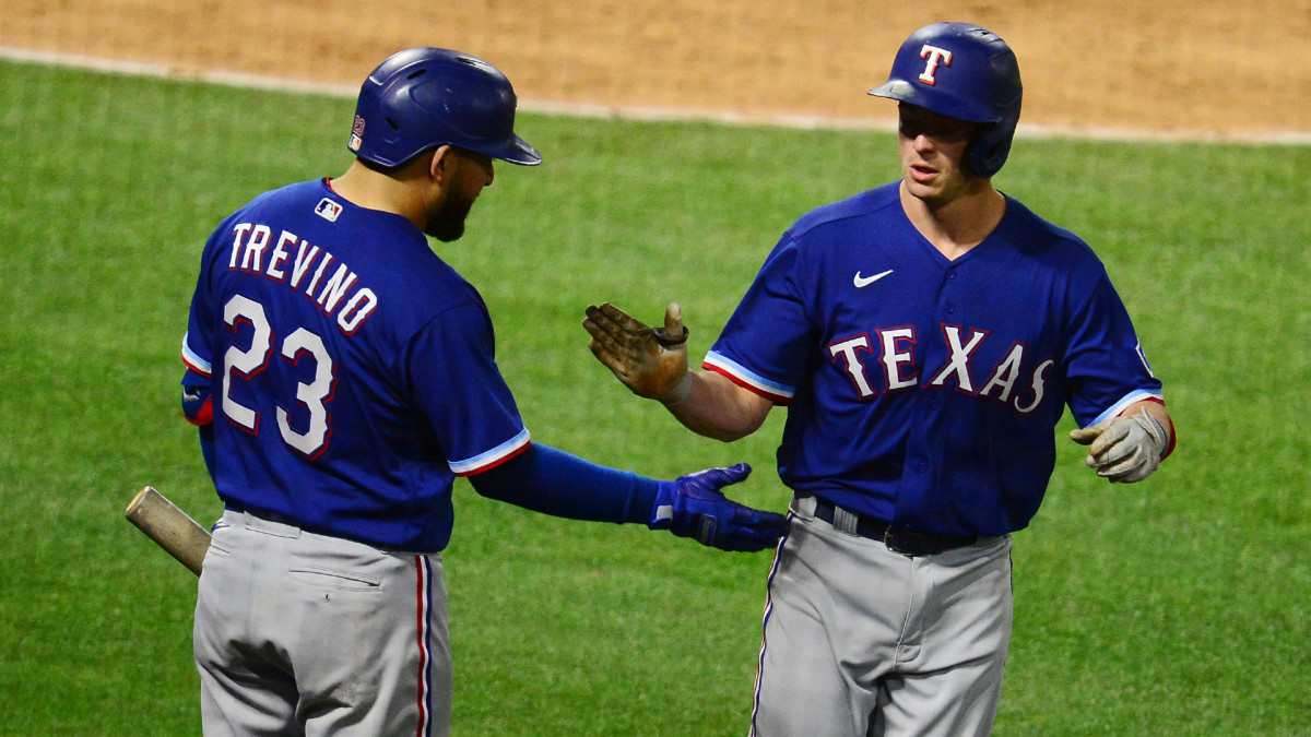 Apr 20, 2021; Anaheim, California, USA; Texas Rangers second baseman Nick Solak (15) is greeted by catcher Jose Trevino (23) after hitting a solo home run against the Los Angeles Angels during the sixth inning at Angel Stadium. Mandatory Credit: Gary A. Vasquez-USA TODAY Sports