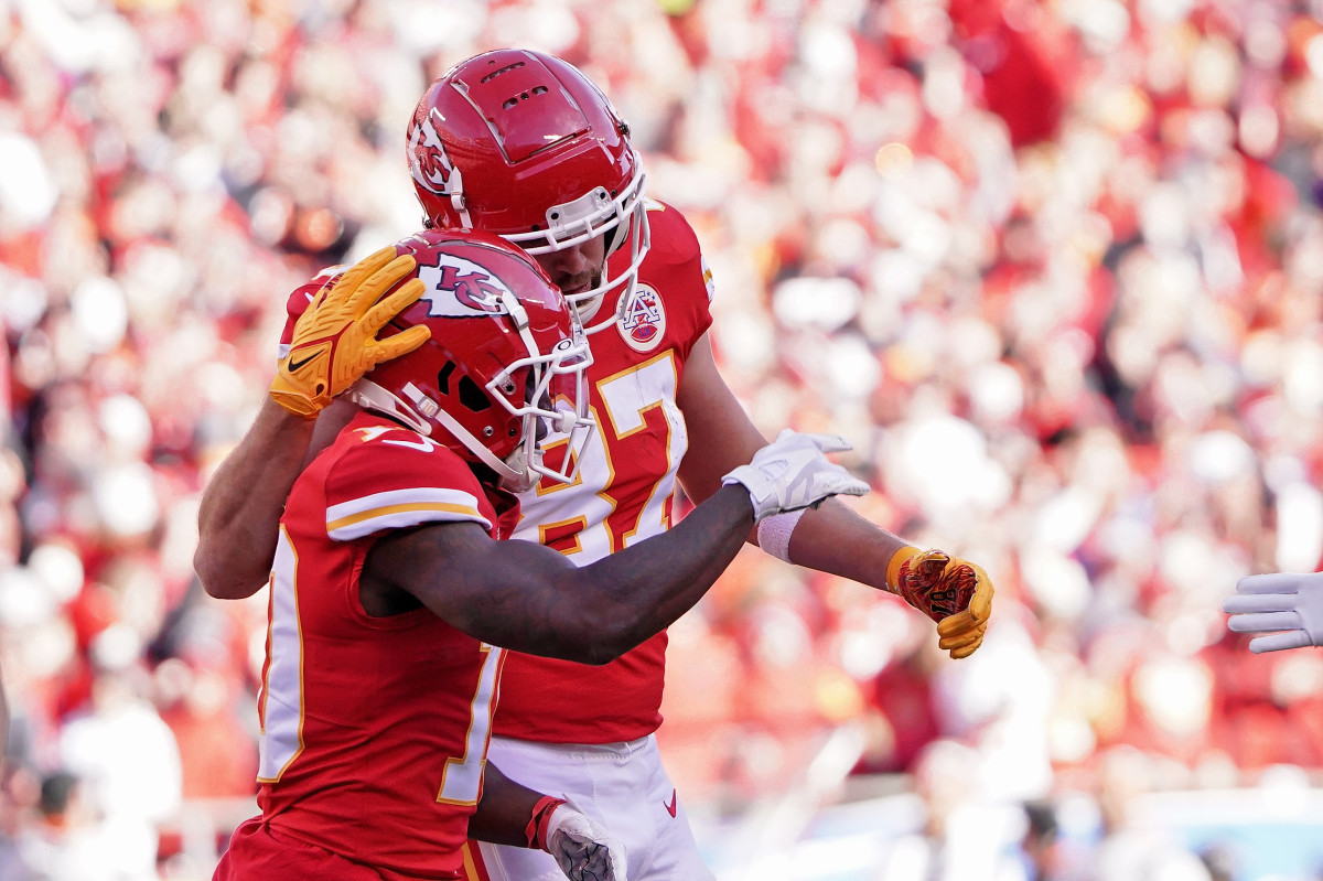 Jan 30, 2022; Kansas City, Missouri, USA; Kansas City Chiefs tight end Travis Kelce (87) celebrates with wide receiver Tyreek Hill (10) after a touchdown against the Cincinnati Bengals during the first quarter of the AFC Championship Game at GEHA Field at Arrowhead Stadium. Mandatory Credit: Denny Medley-USA TODAY Sports