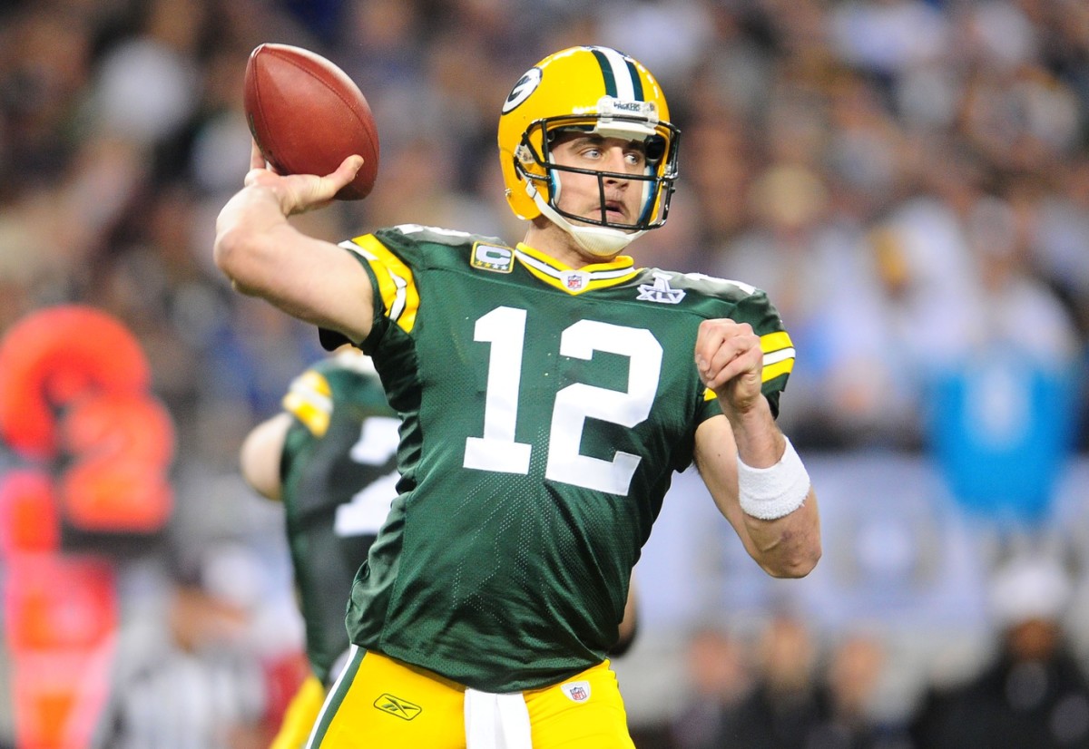 Green Bay Packers quarterback Aaron Rodgers (12) passes the ball against the Pittsburgh Steelers during the first half of Super Bowl XLV at Cowboys Stadium.