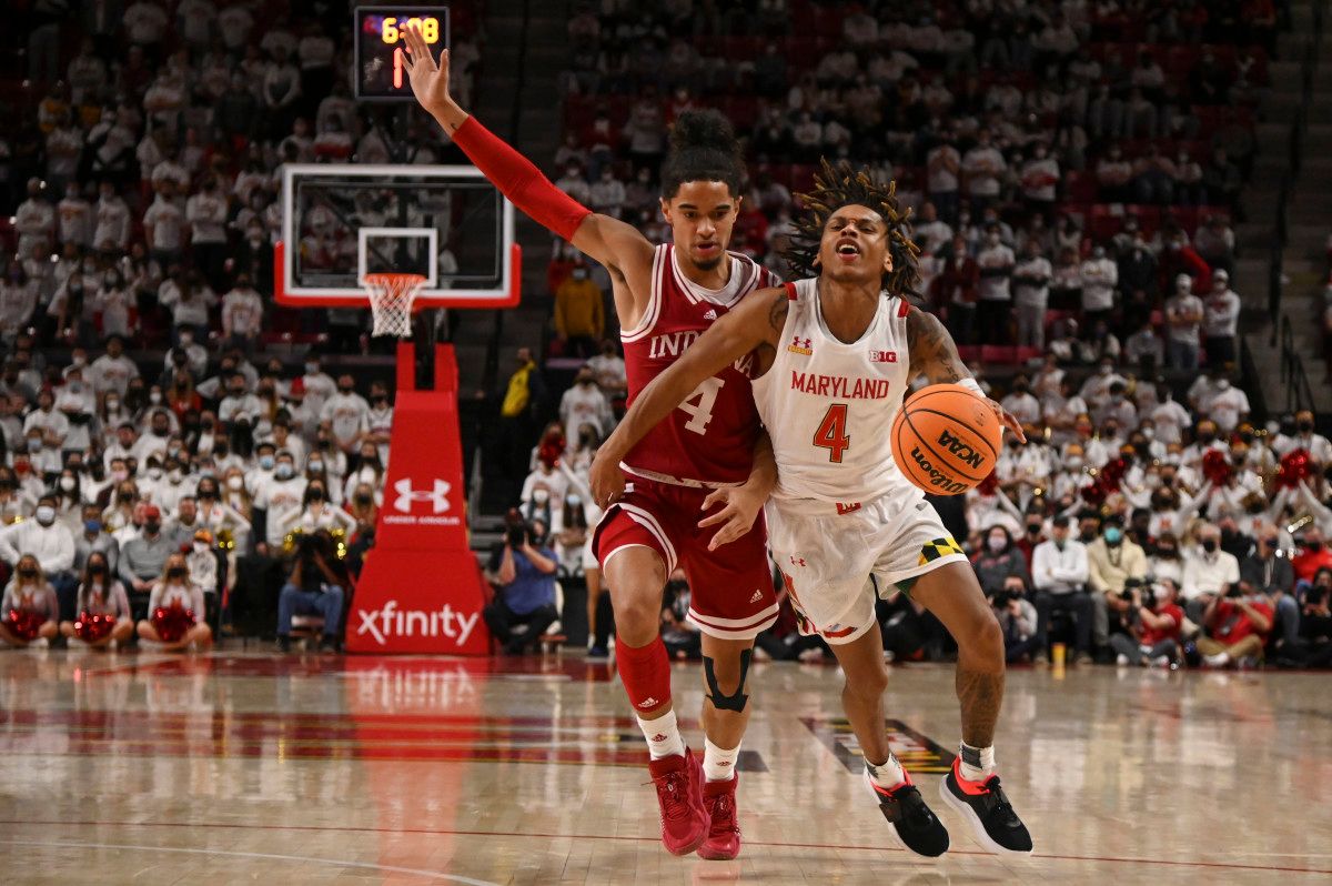 Khristian Lander runs into a Maryland player in Xfinity Center.