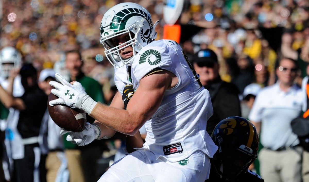 Colorado State Rams tight end Trey McBride (85) runs with the ball after a catch as Iowa Hawkeyes linebacker Jestin Jacobs (5) goes to make the tackle during the second quarter at Kinnick Stadium.