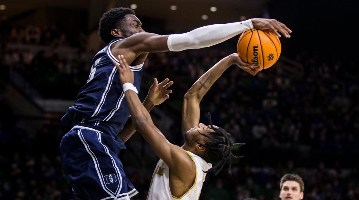 Duke's Mark Williams, left, blocks a shot by Notre Dame's Blake Wesley during the second half of an NCAA college basketball game Monday, Jan. 31, 2022, in South Bend, Ind.