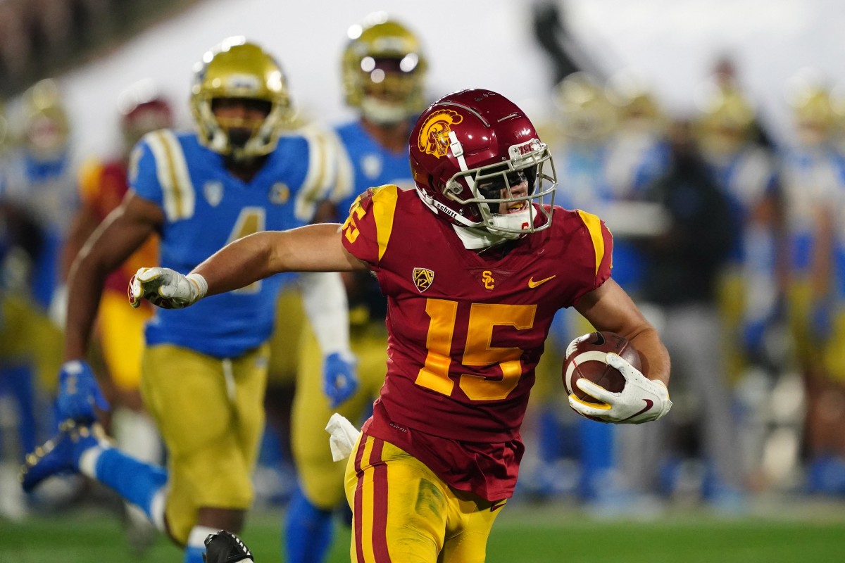 Dec 12, 2020; Pasadena, California, USA; Southern California Trojans wide receiver Drake London (15) scores on a 65-yard touchdown reception in the second quarter against the UCLA Bruins at Rose Bowl. Mandatory Credit: Kirby Lee-USA TODAY Sports