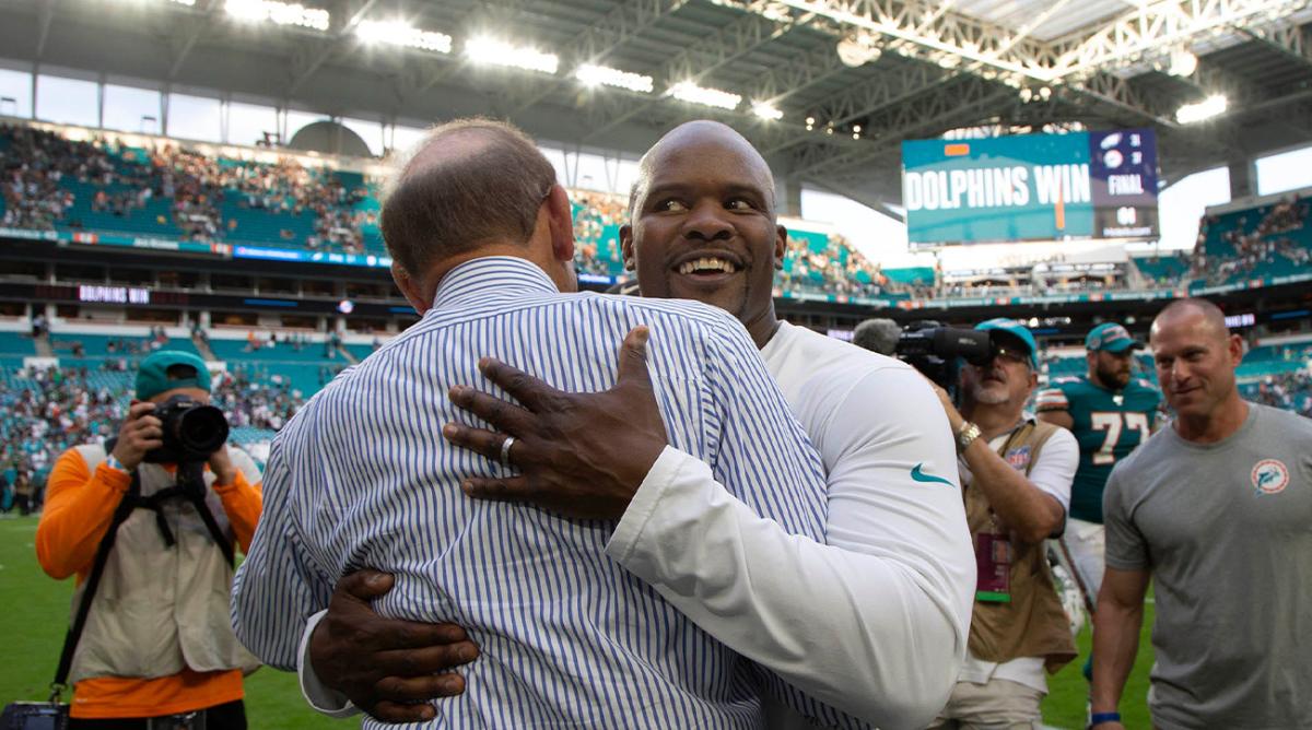 Miami Dolphins owner Stephen Ross hugs Miami Dolphins head coach Brian Flores after win over the Philadelphia Eagles in Miami Gardens, Dec. 1, 2019. Miami Dolphins Vs Philadelphia Eagles