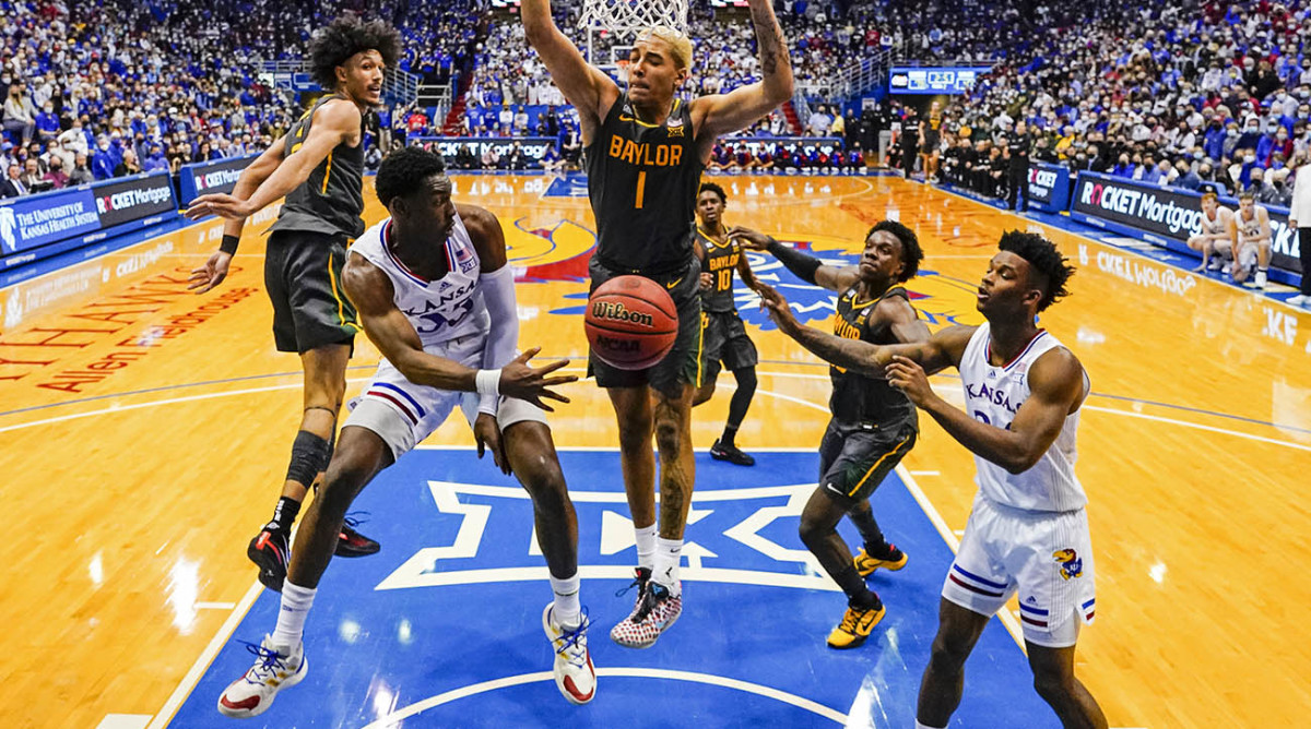 Kansas Jayhawks guard Jalen Coleman-Lands (55) passes to forward K.J. Adams (24) during the second half against the Baylor Bears at Allen Fieldhouse.
