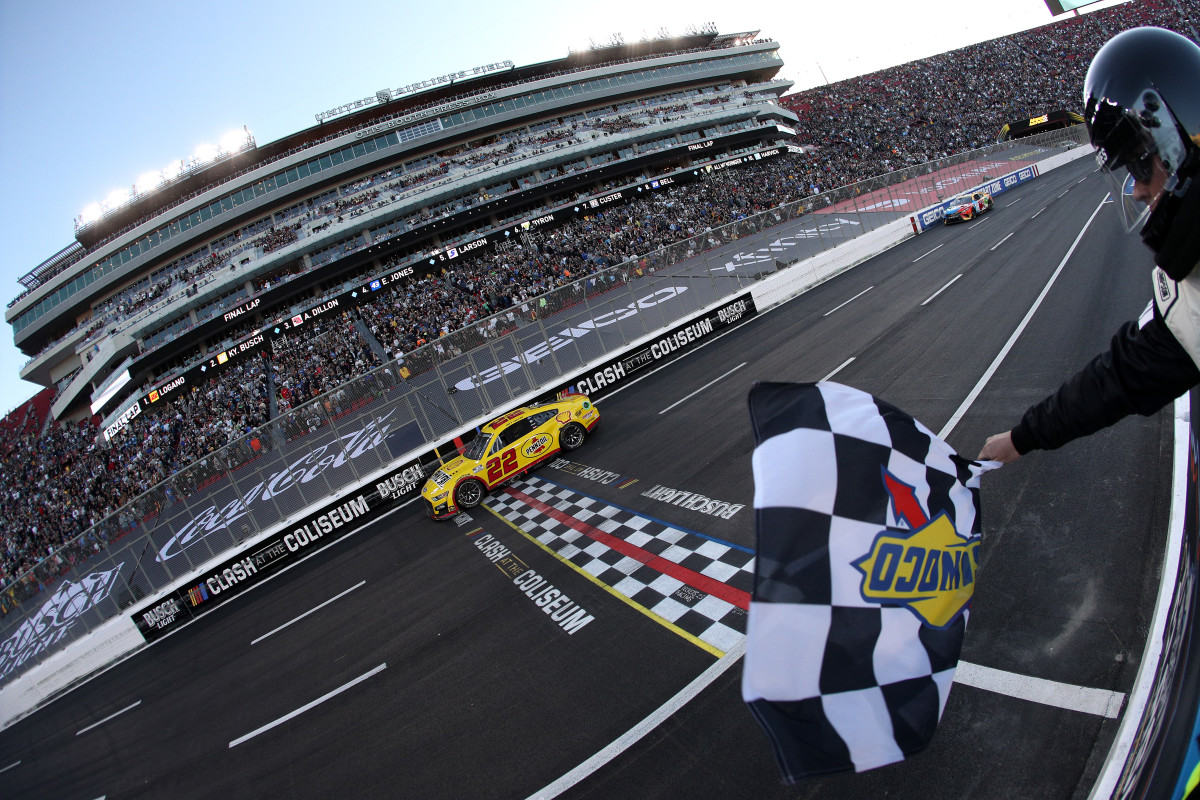 Joey Logano, driver of the #22 Shell Pennzoil Ford, takes the checkered flag to win the NASCAR Cup Series Busch Light Clash at the Los Angeles Memorial Coliseum. (Photo by Sean Gardner/Getty Images)
