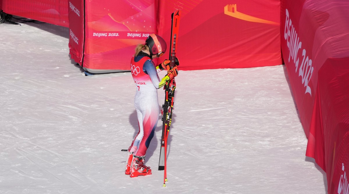 Mikaela Shiffrin stands with her skis after a giant slalom run