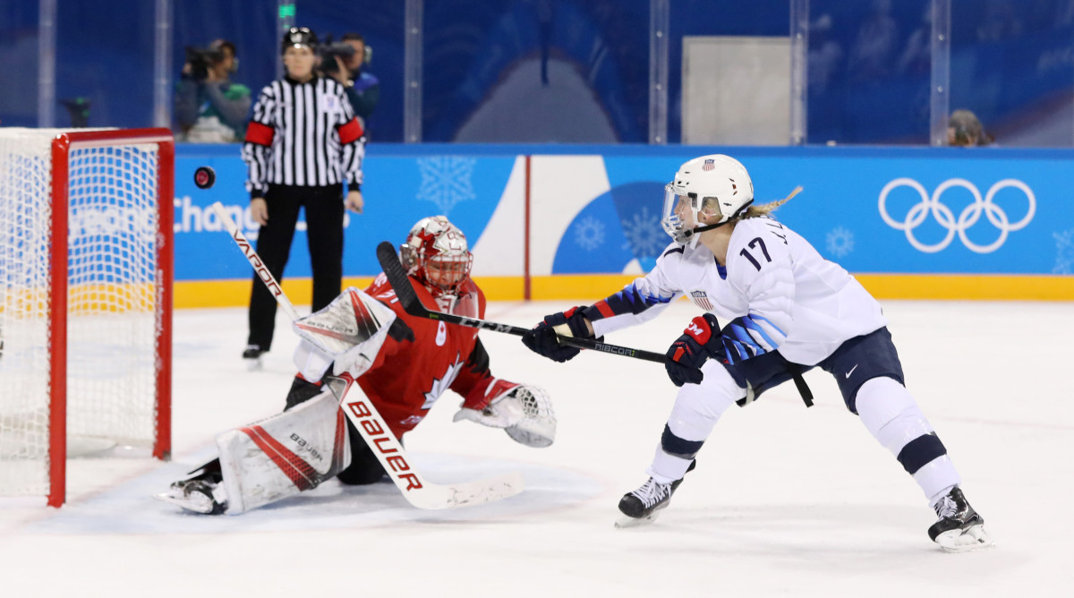 U.S. forward Lamoureux-Davidson and Canada's Shannon Szabados in PyeongChang 2018.