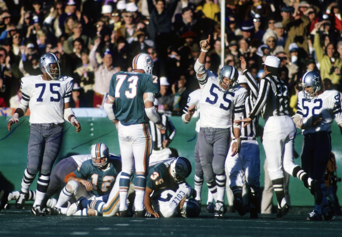 Cowboys linebacker Lee Roy Jordan (55) and Jethro Pugh (75) react after recovering a fumble against the Miami Dolphins during Super Bowl VI at Tulane Stadium.