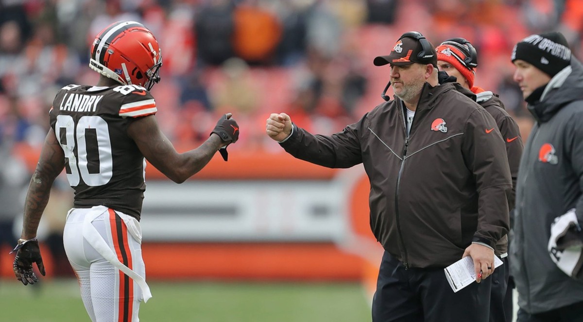 Cleveland Browns wide receiver Jarvis Landry (80) fist bumps offensive coordinator Alex Van Pelt as he comes off the field during the second half of an NFL football game against the Cincinnati Bengals, Sunday, Jan. 9, 2022, in Cleveland, Ohio. [Jeff Lange/Beacon Journal] jarvis van pelt