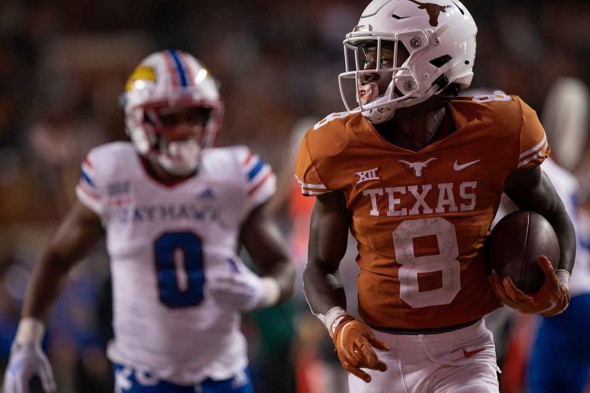 Texas receiver Xavier Worthy runs for a touchdown against Kansas.